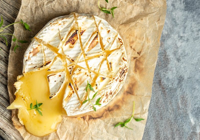 Baked camembert with roasted grapes, walnuts, rosemary and pink peppercorn crackers